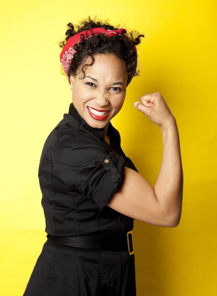 Someone posing as Rosie the Riveter